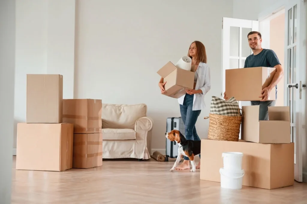 Happy couple smiling after move to a new home